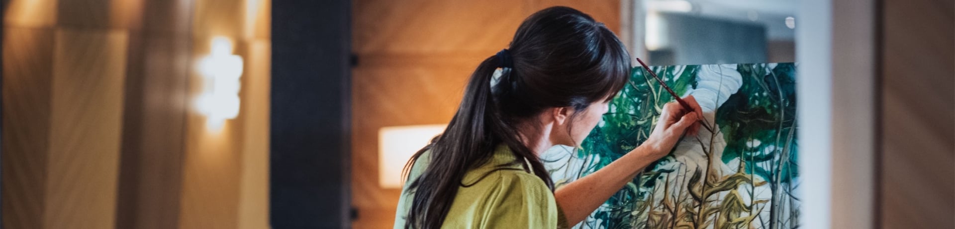 woman painting in the lobby