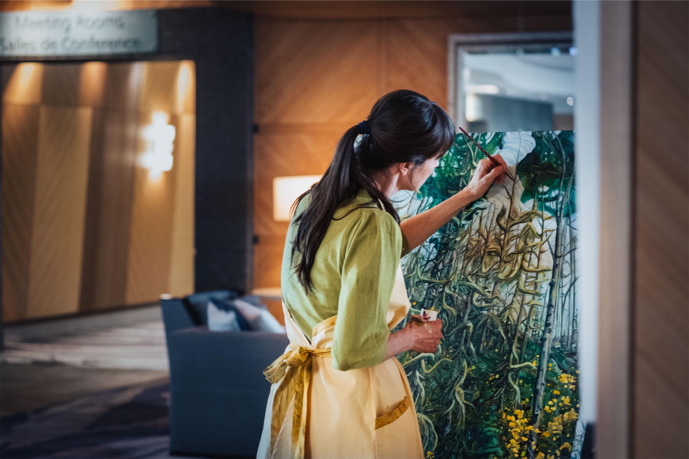 woman painting in the lobby