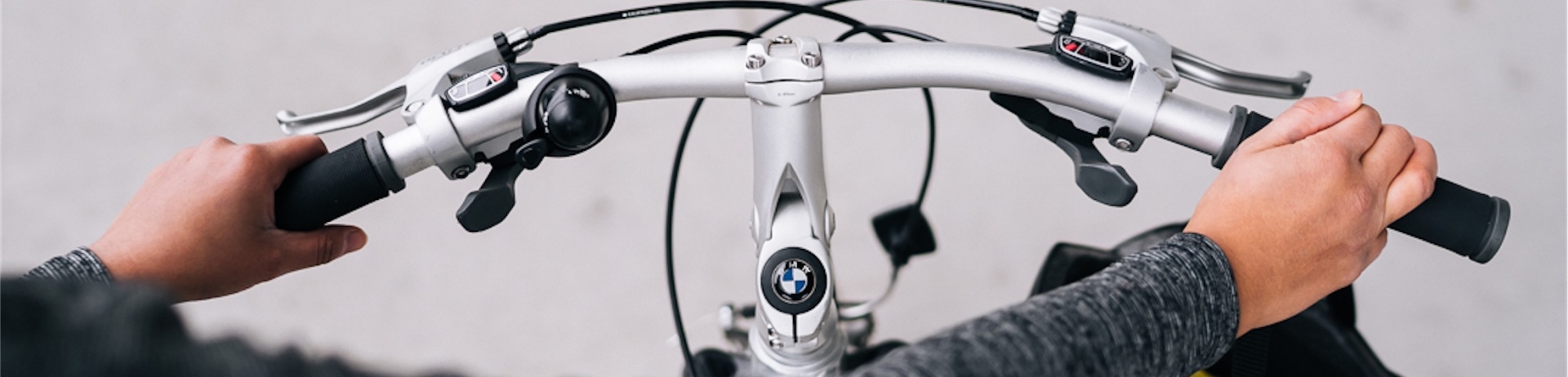 someone pushing a bmw bike