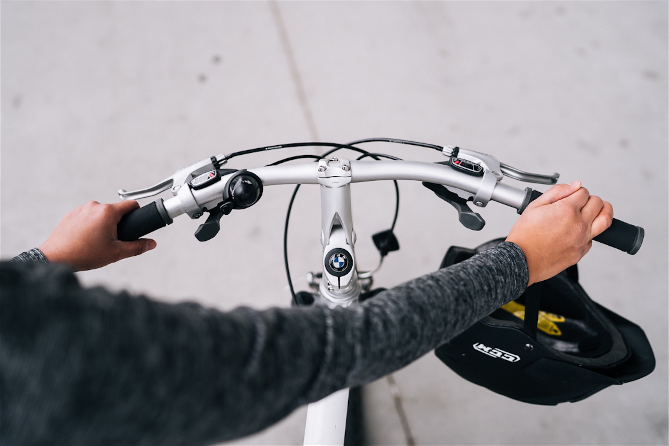 someone pushing a bmw bike