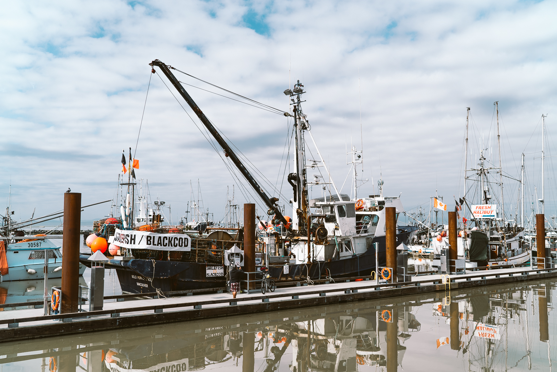 fishing boat docked at pier