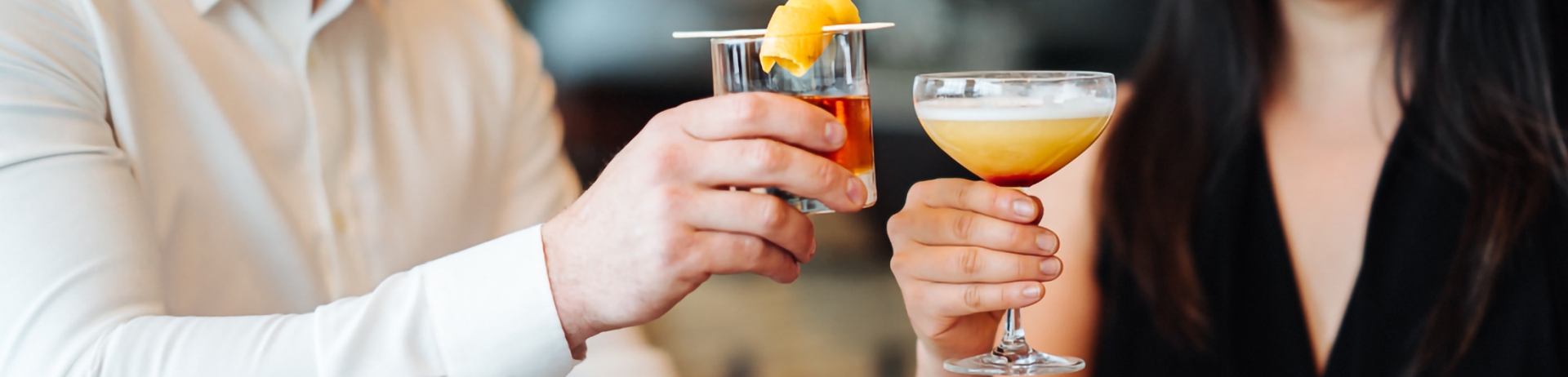 a couple drinking cocktails