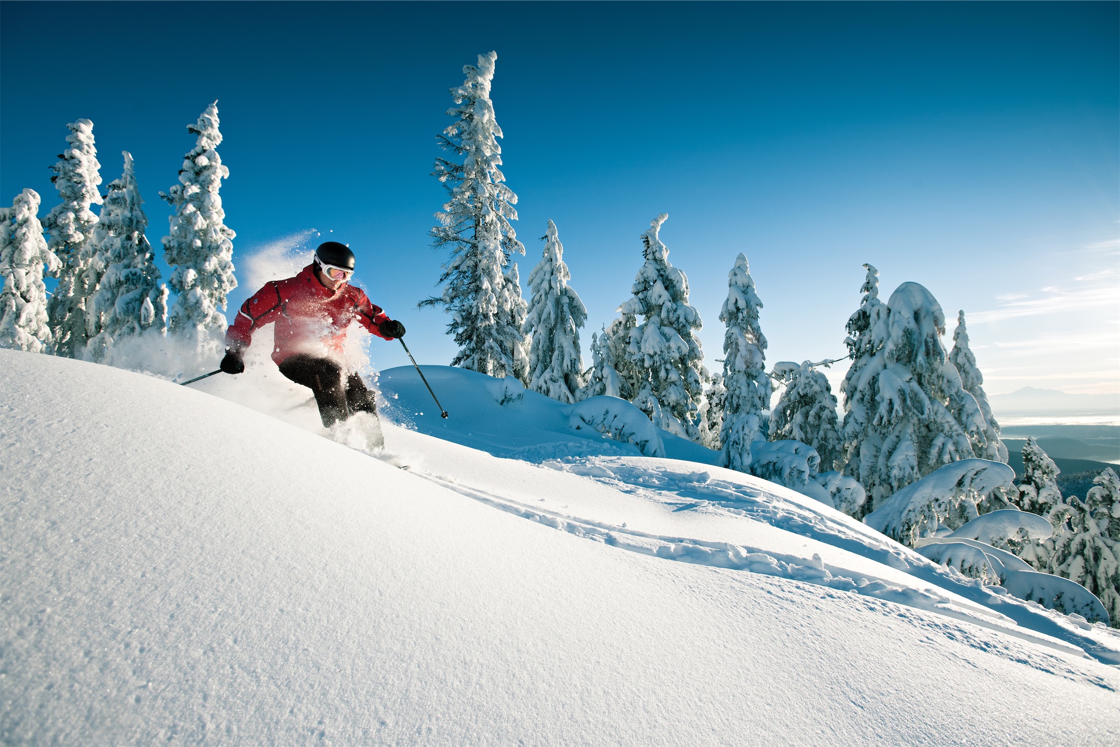 man skiing down a mountain