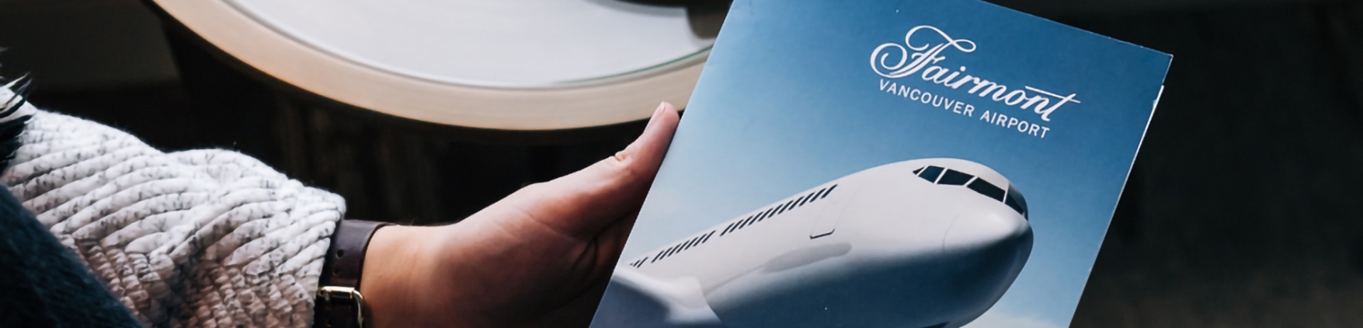 woman holding a plane spotting guide