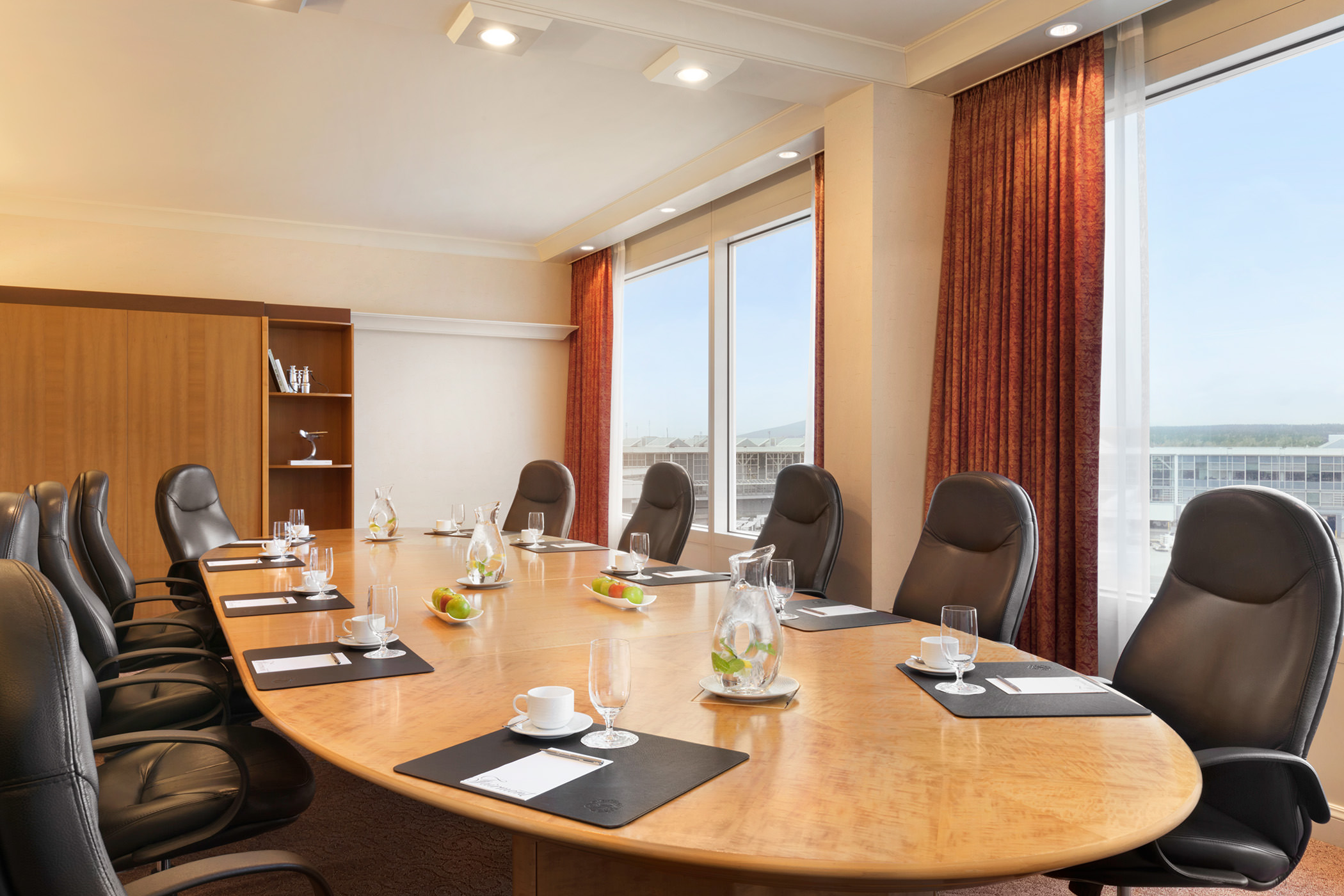 meeting room with large oval table that seats ten