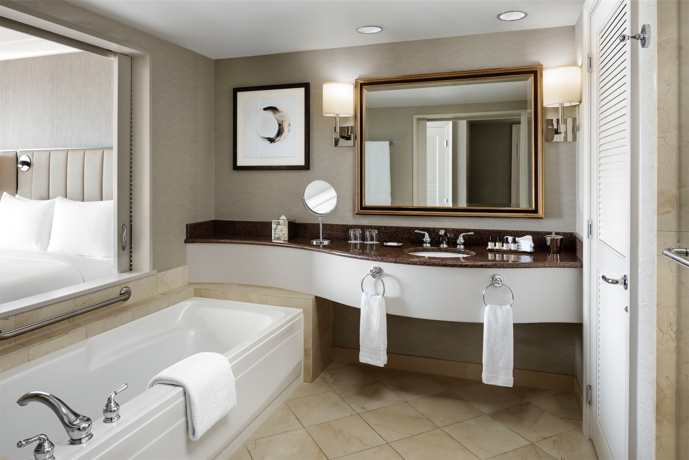 bathroom with long vanity and tub