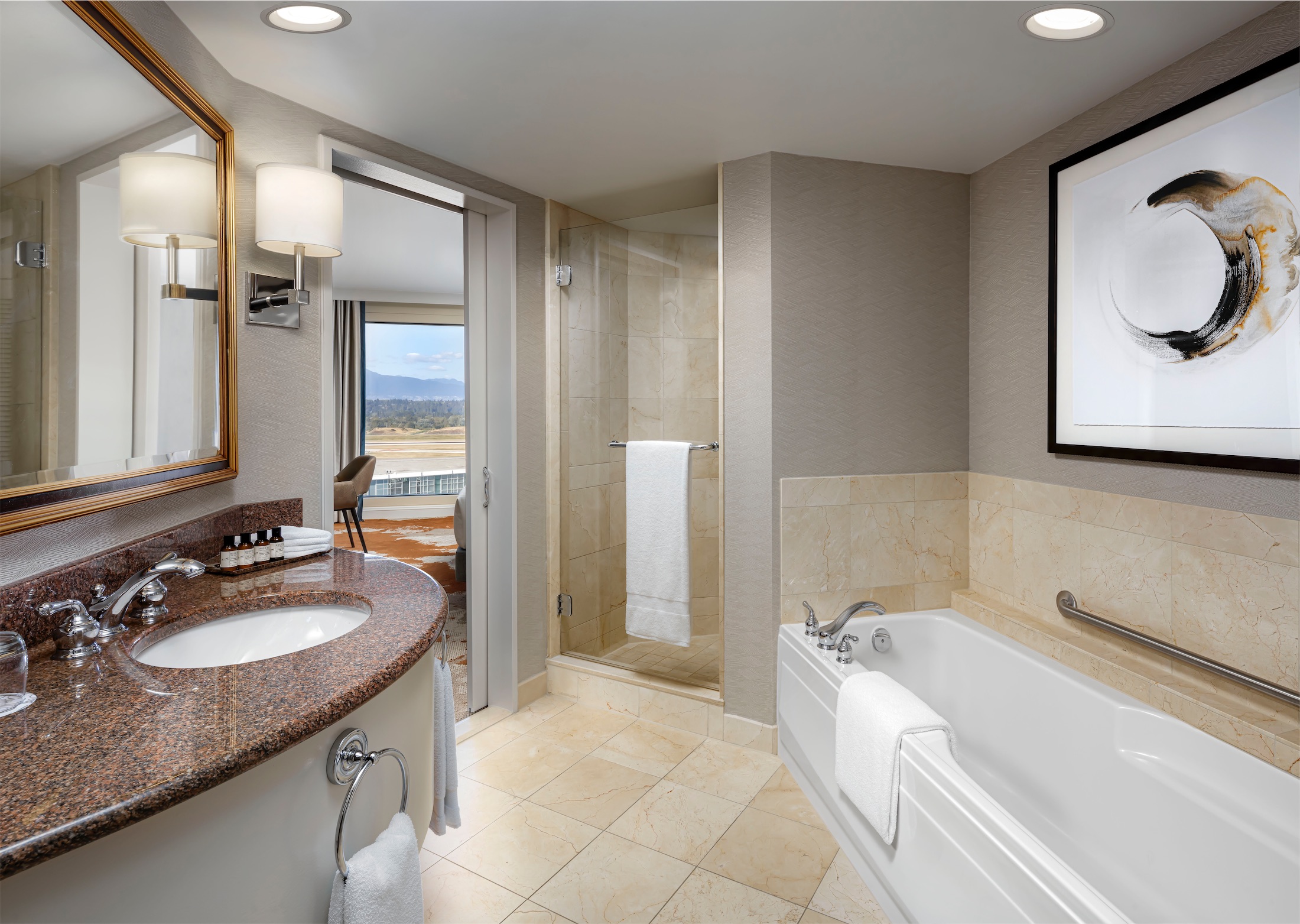 Bathroom with a tub and walk-in shower