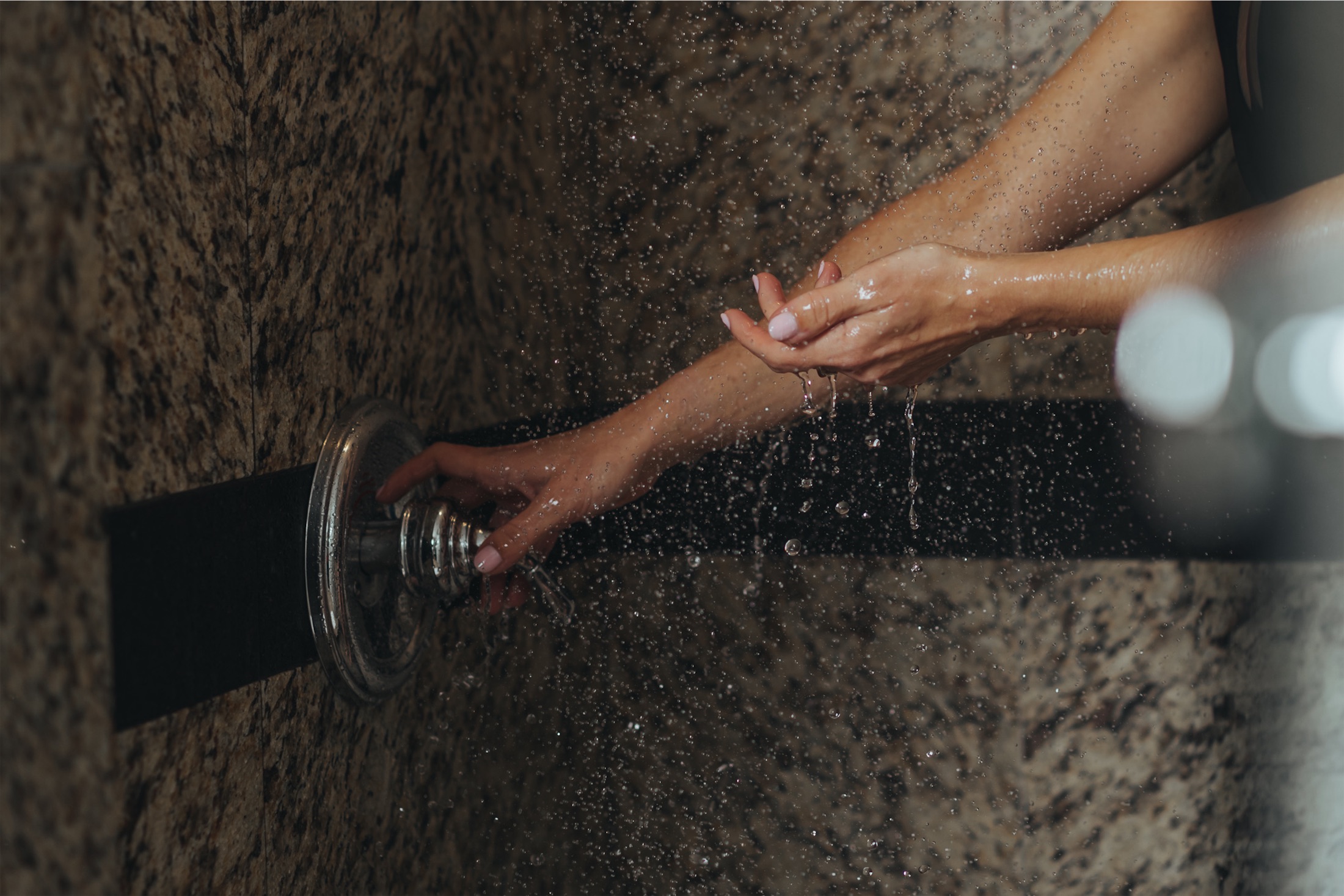 woman turning on the shower