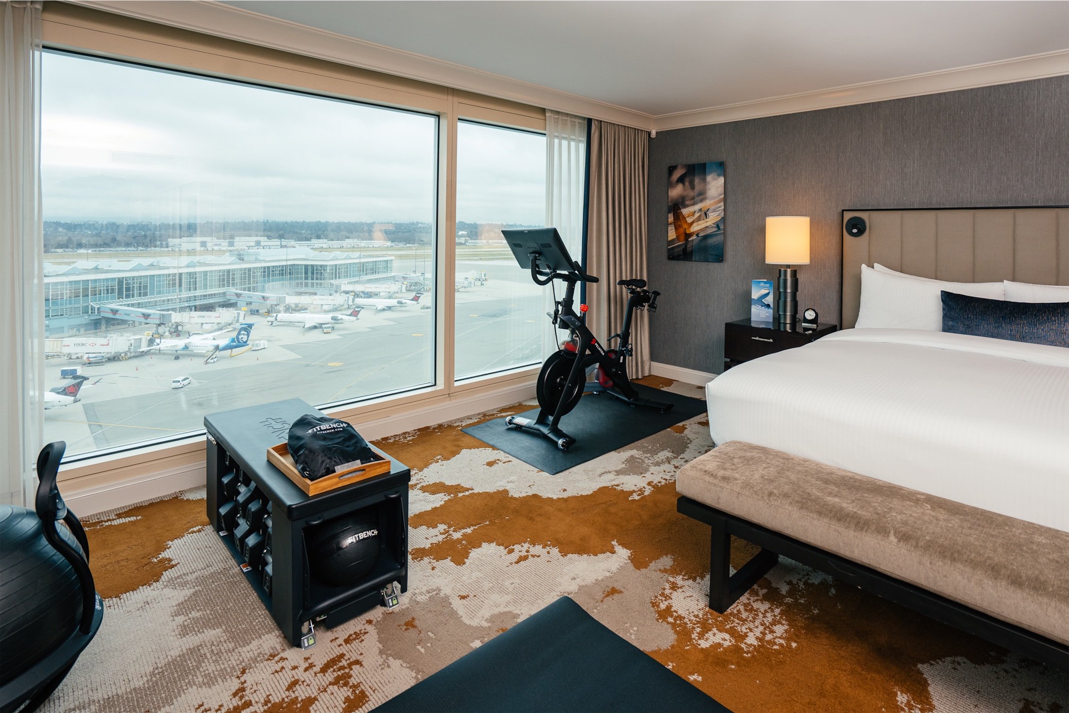 bedroom with a pelotone and pilates equipment