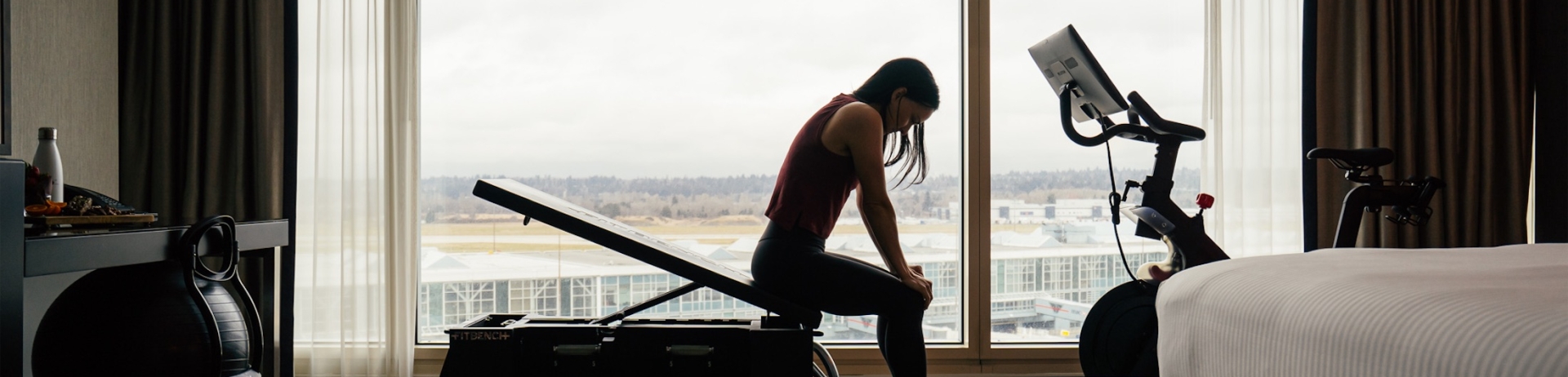 a woman taking a break from her work out