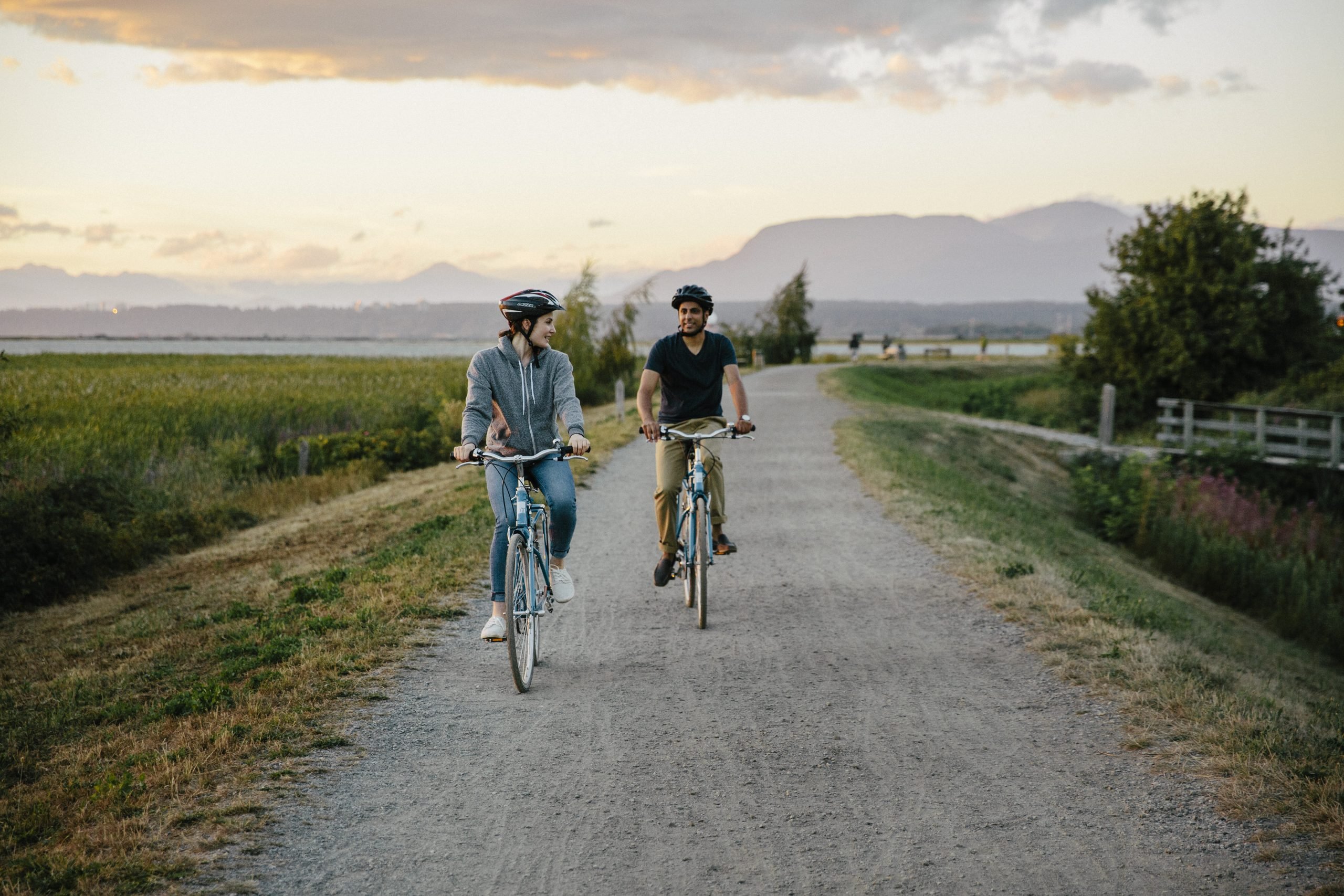 couple biking on a gravel path