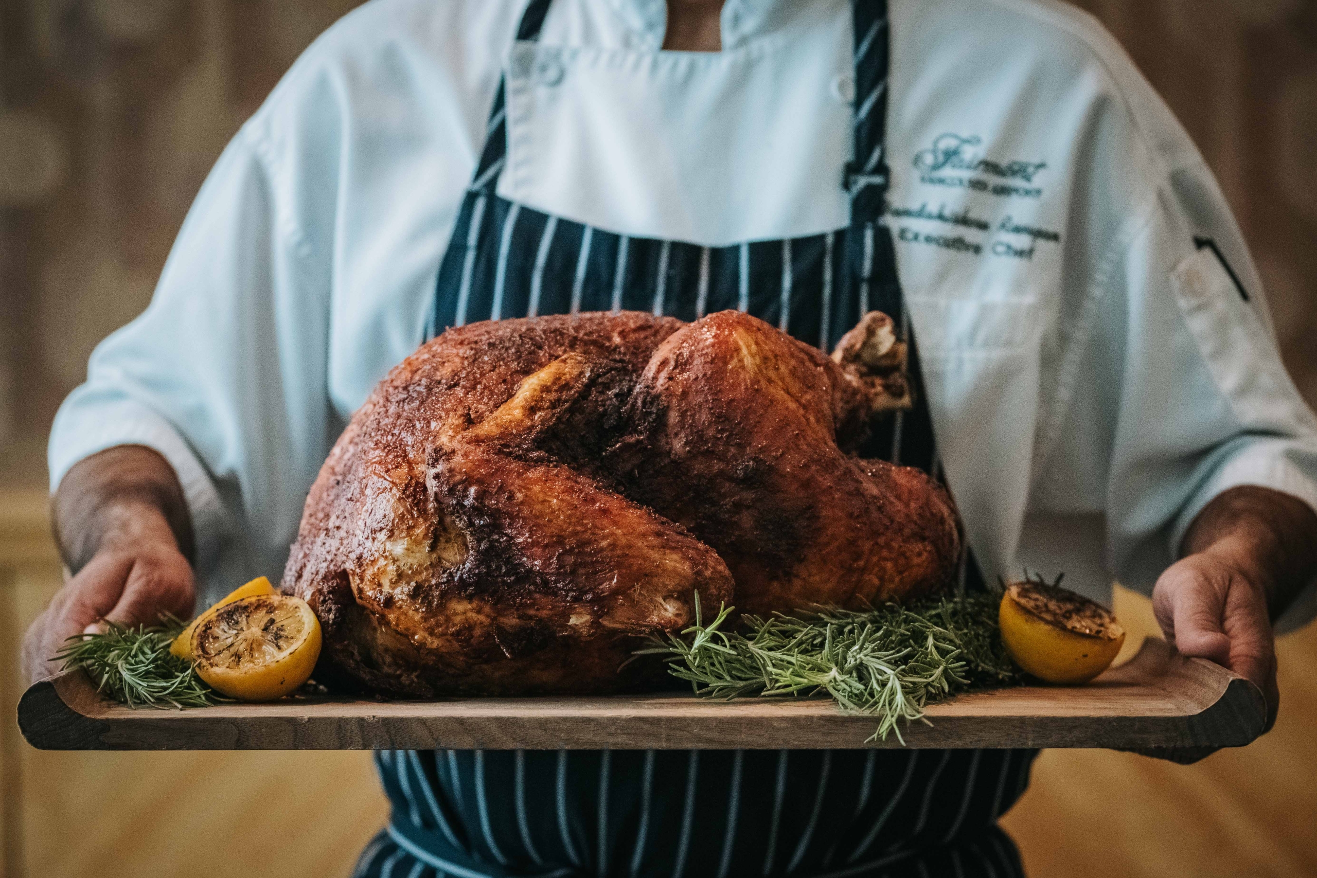 Chef presenting a roasted turkey
