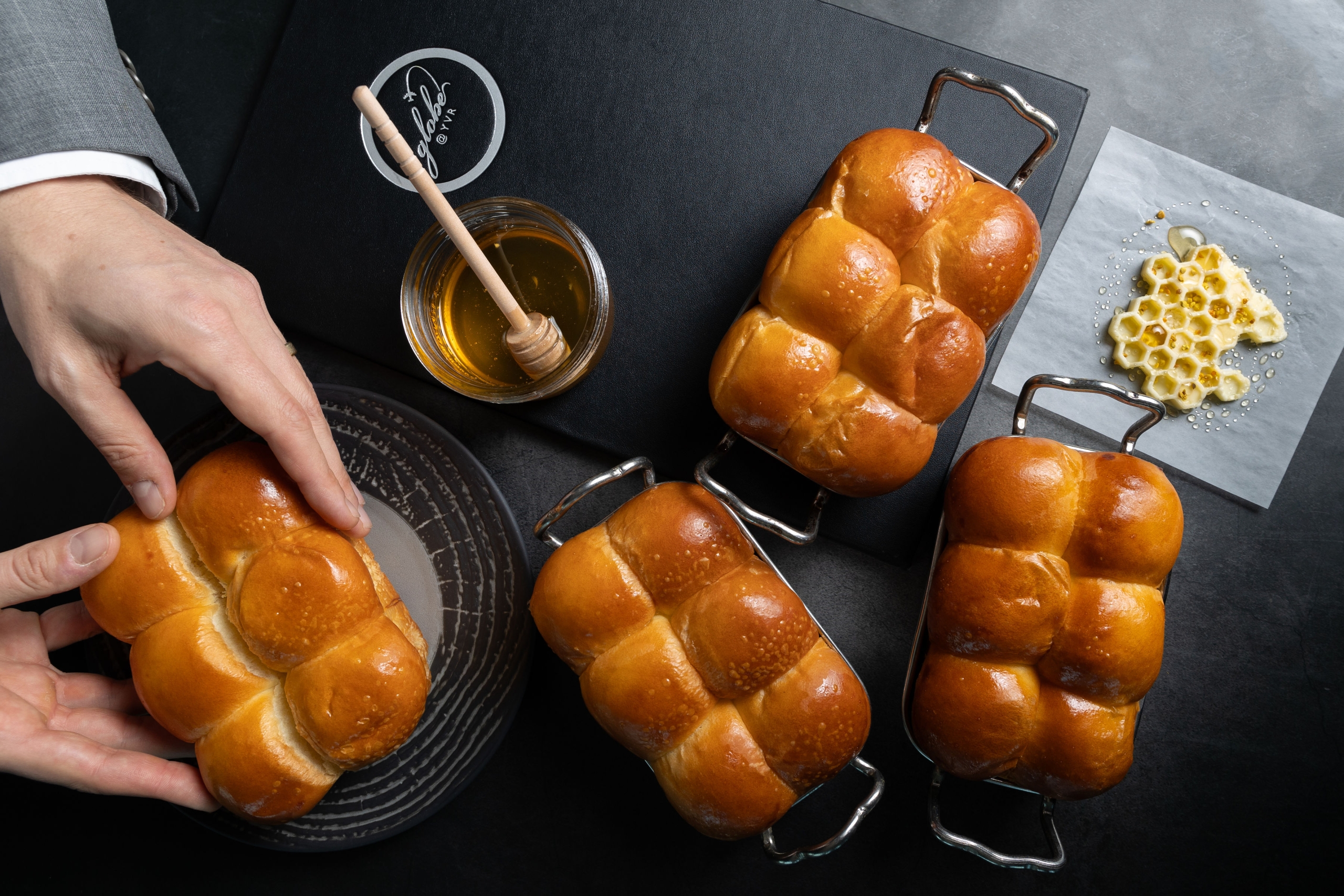 Freshly baked bread with honeycomb shaped butter