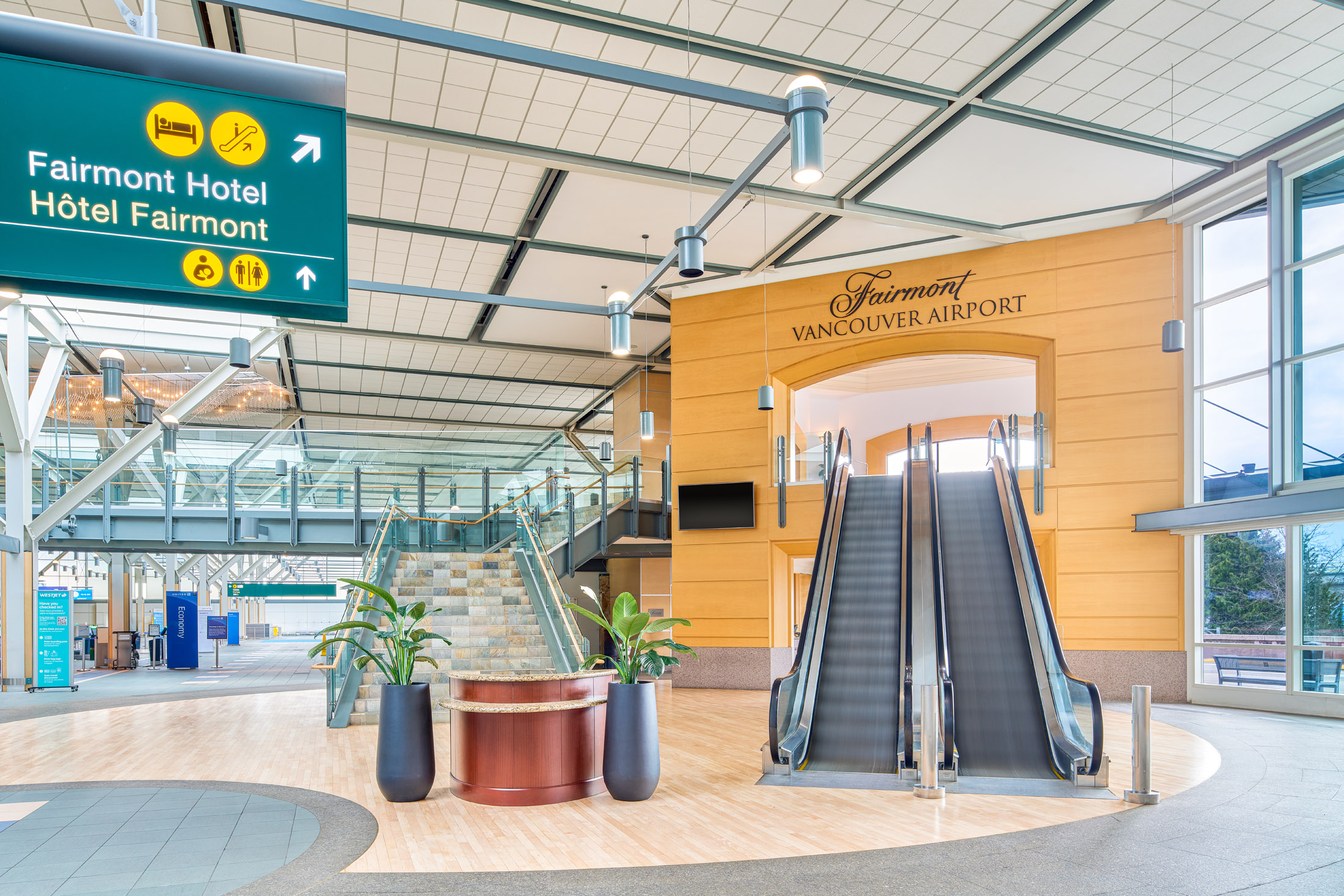 Escalator leading to the main entrance of Fairmont Vancouver Airport from the main airport terminal